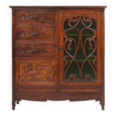 Remarkable Art Nouveau cabinet in oak with green glass door and floral decoration, France, 1910