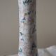 Table lamp for bedside use in earthenware with a wooden base.