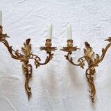 Pair of vintage French wall sconces in bronze, Louis XV Rococo style.