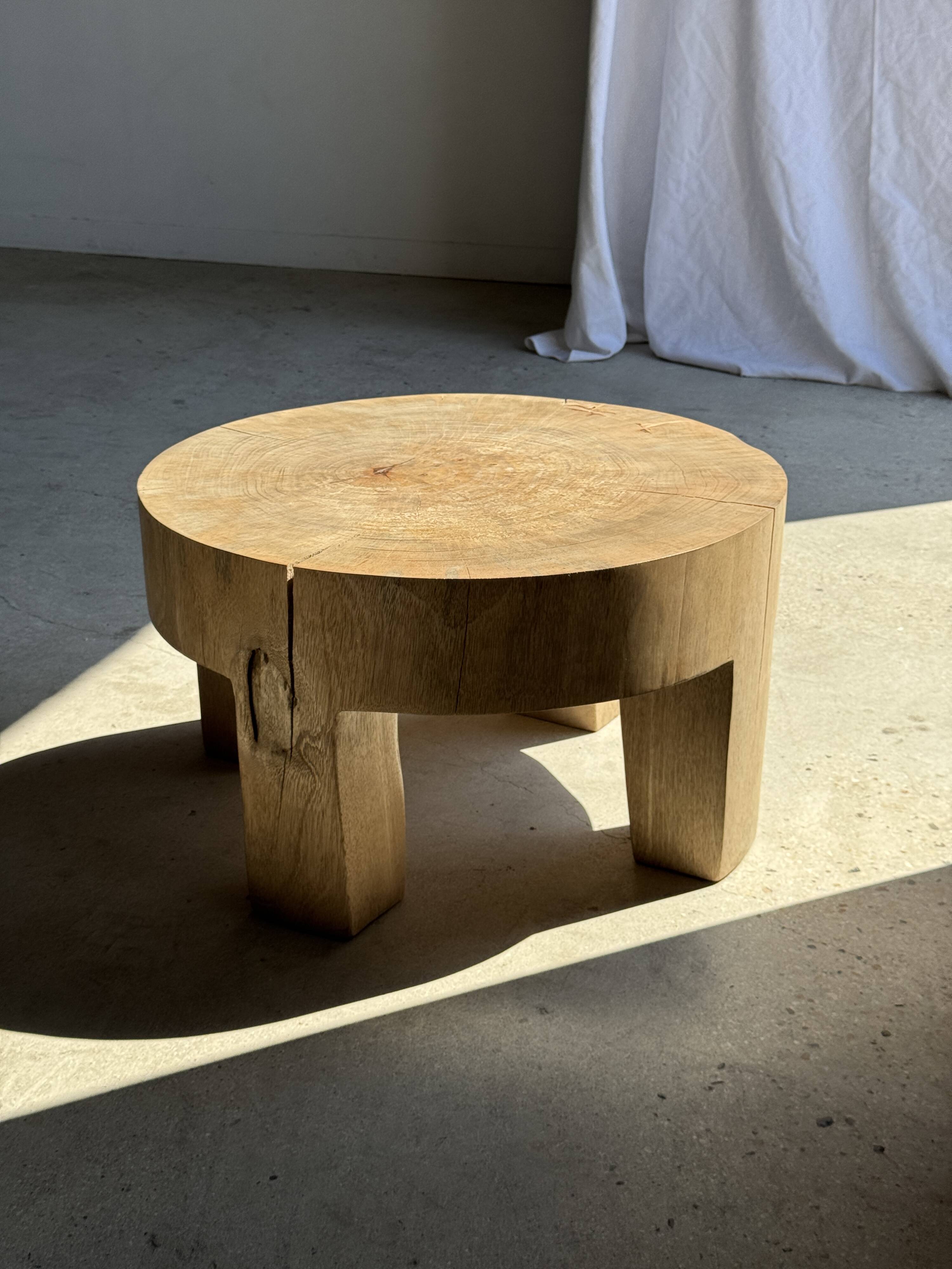 Coffee table, four-legged low table in natural solid monoxyle mango wood.
