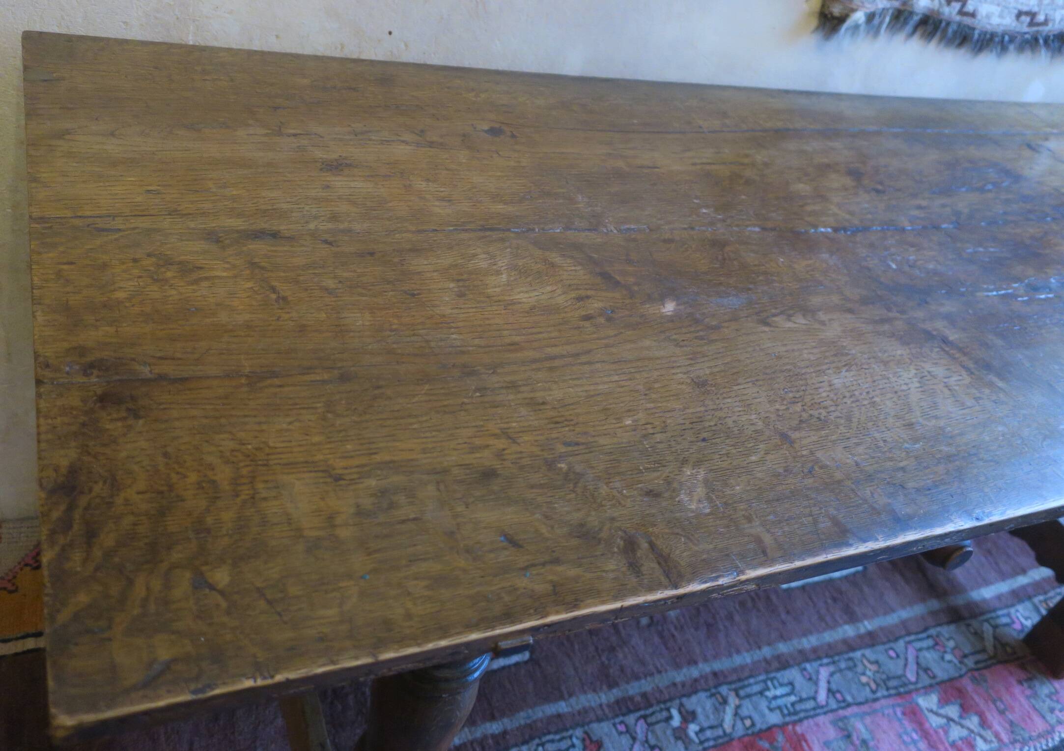 Antique patinated oak dining table, 18th century