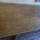 Antique patinated oak dining table, 18th century