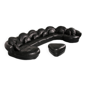 Organically shaped post-modern sectional sofa in black leather