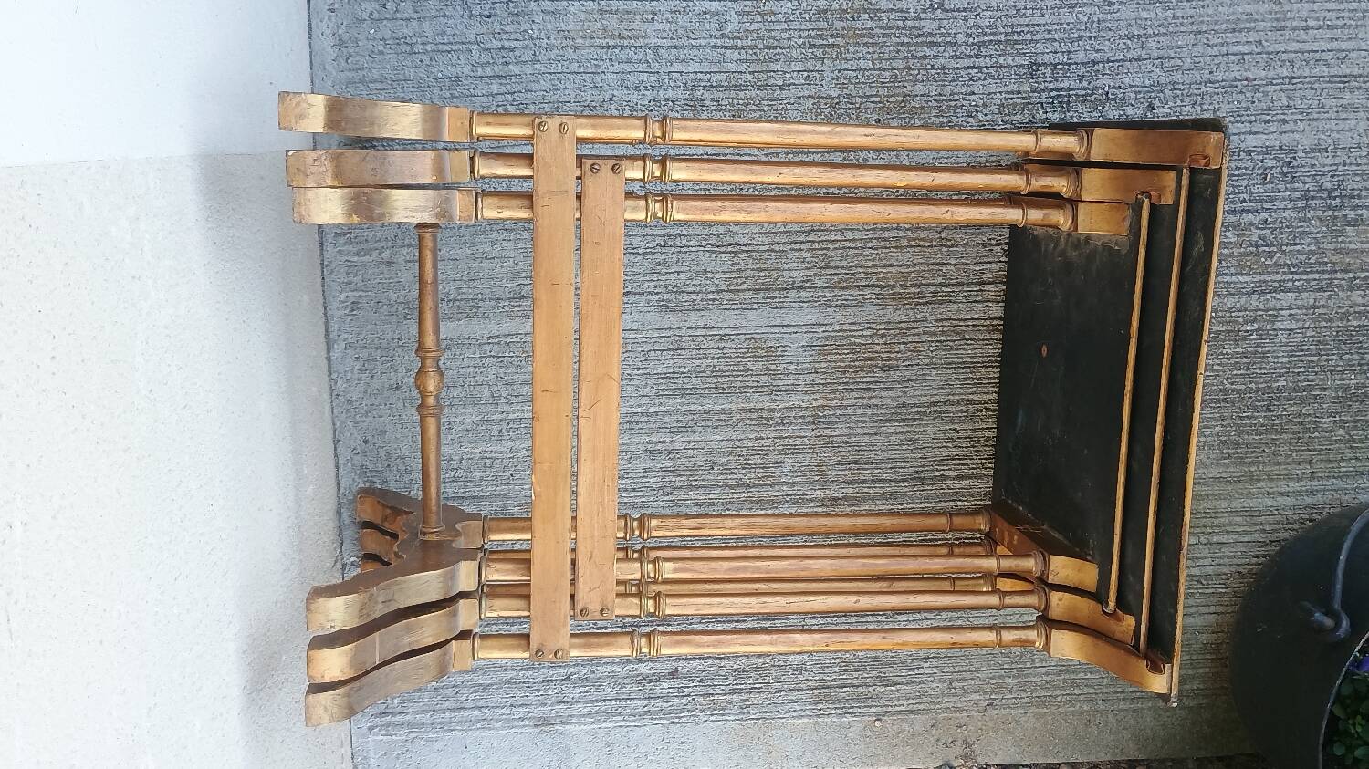 Sets of three nesting tables with painted landscape decorations in poplar.