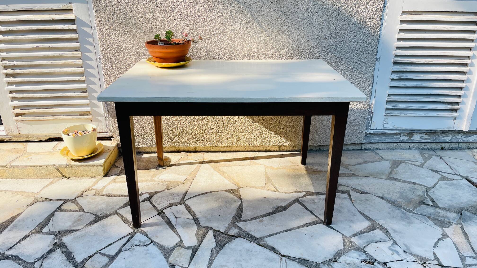 Vintage oak farmhouse table with a white top.