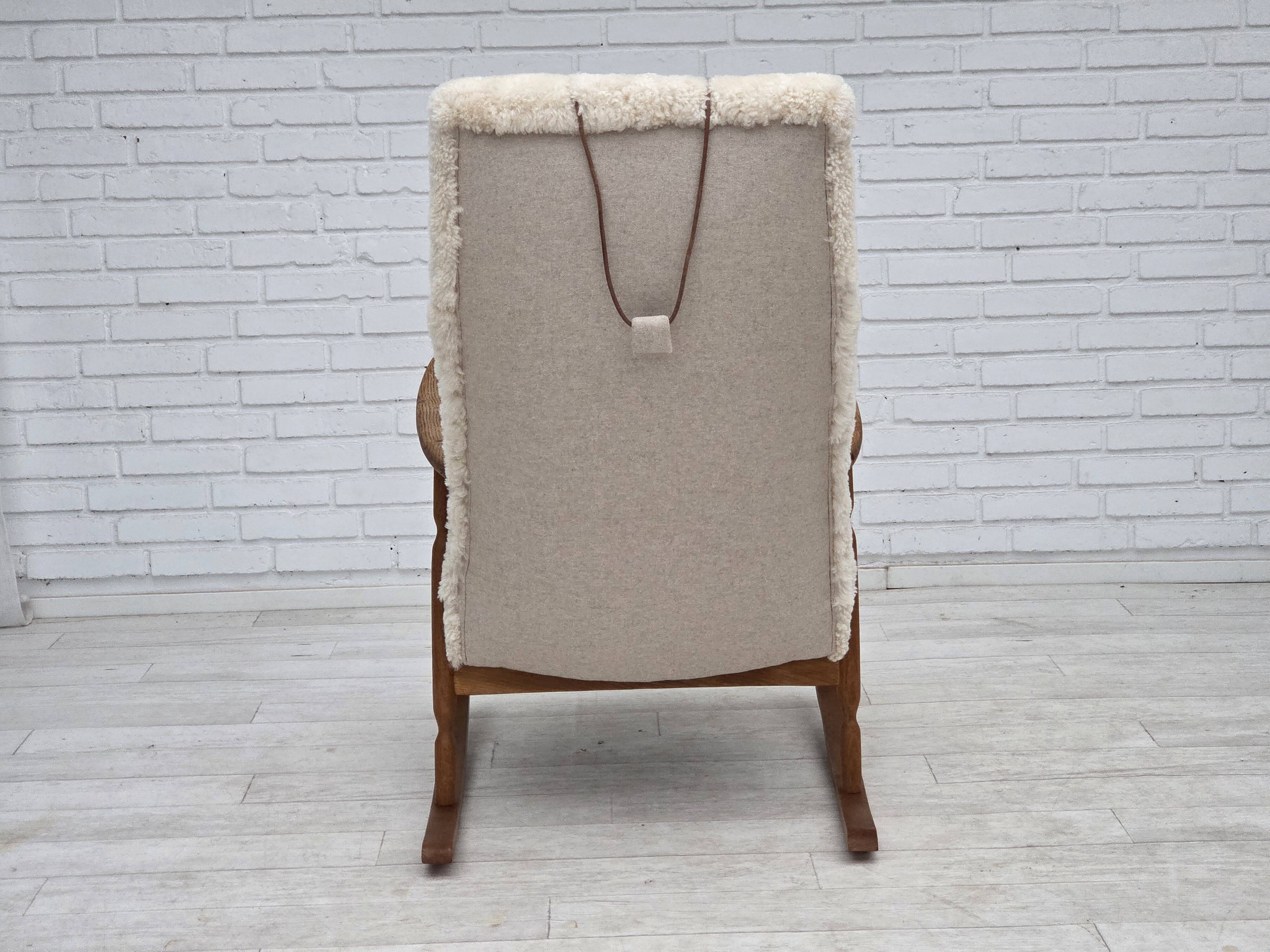1970s, Danish rocking chair, reupholstered in quality genuine sheepskin.