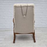 1970s, Danish rocking chair, reupholstered in quality genuine sheepskin.
