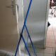 Adjustable mirror on vintage blue tubular structure stand