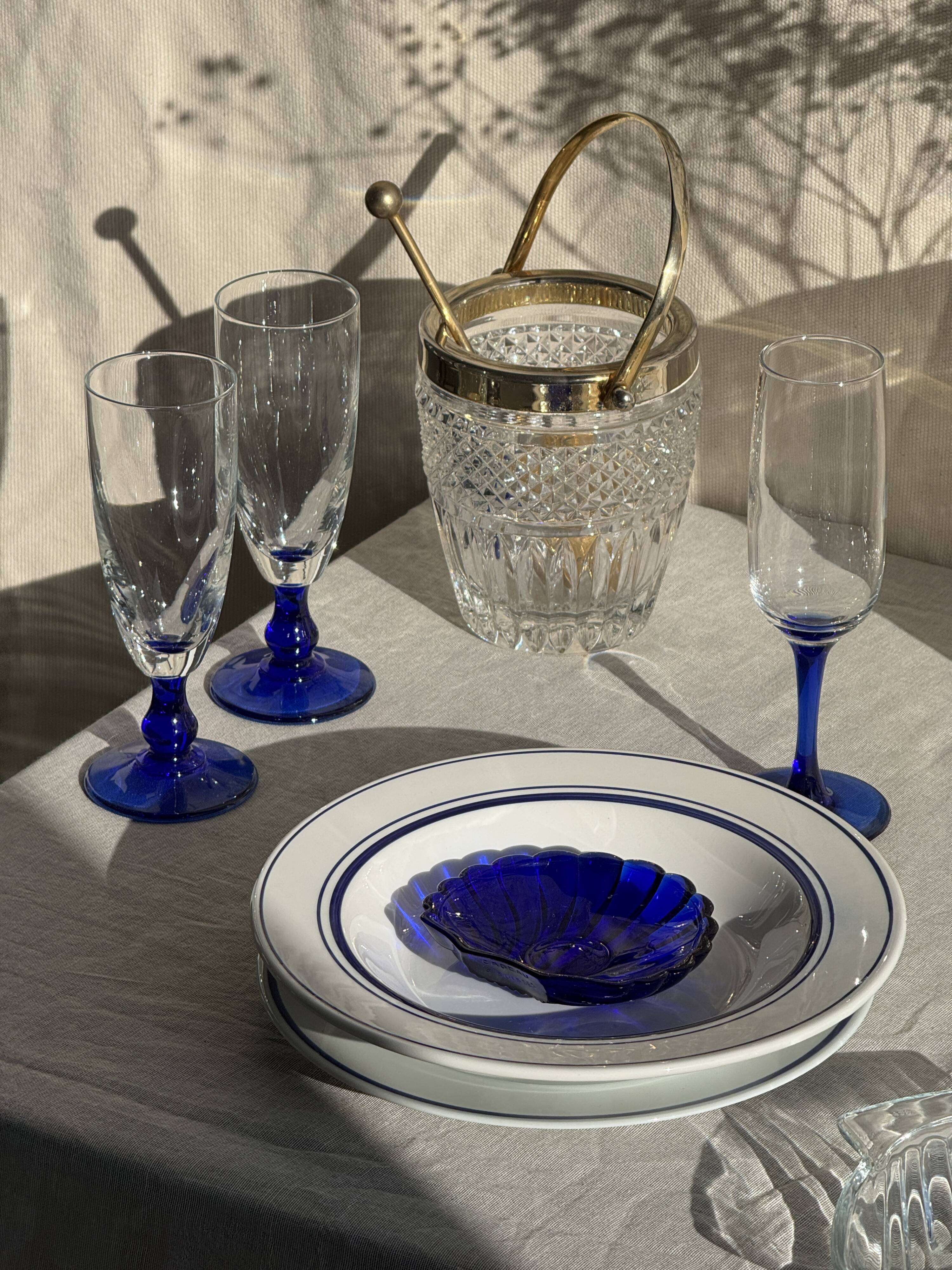 Small golden glass ice bucket with diamond point design and its scoop.