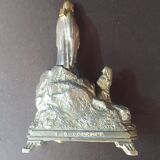 Metal statue and music box