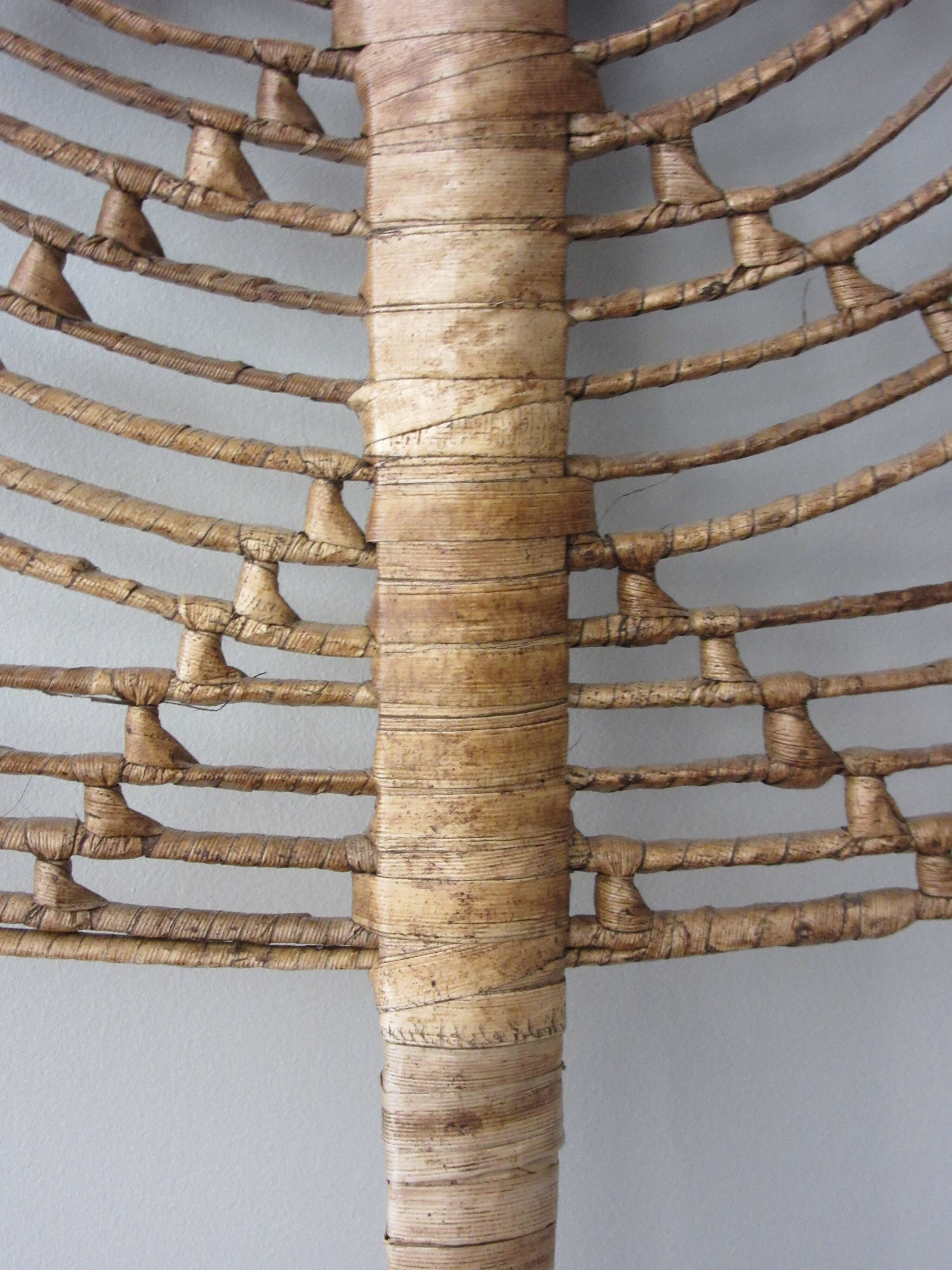 Vintage fan in palm leaves