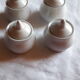 Set of 4 small covered pots in white porcelain