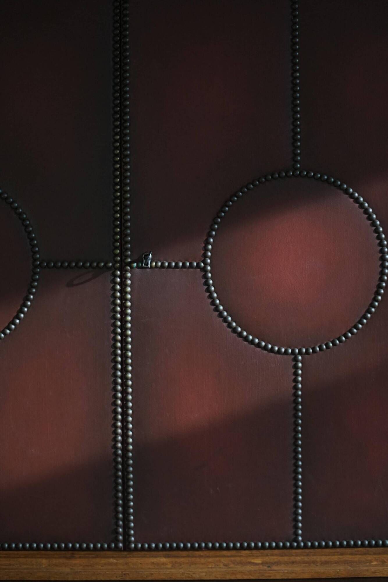 Otto Schulz, modern Swedish wardrobe in leather, oak and brass studs, 1930s.