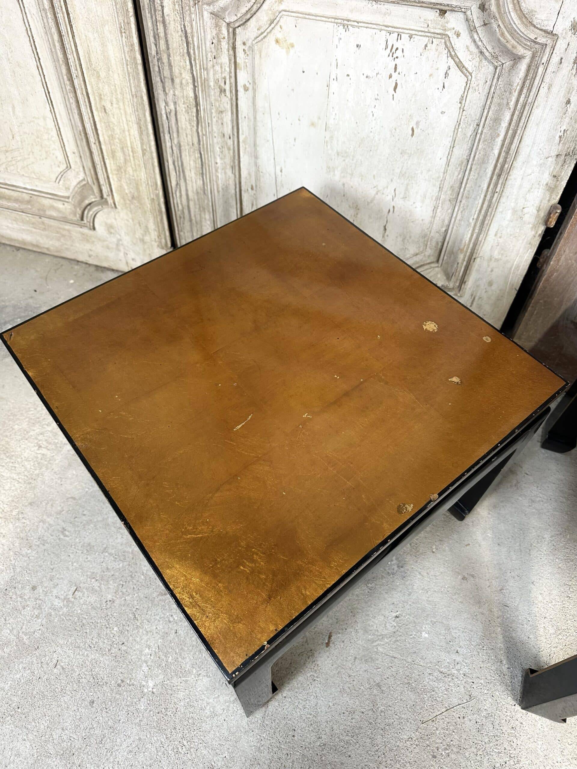Pair of side tables in black and gold lacquer