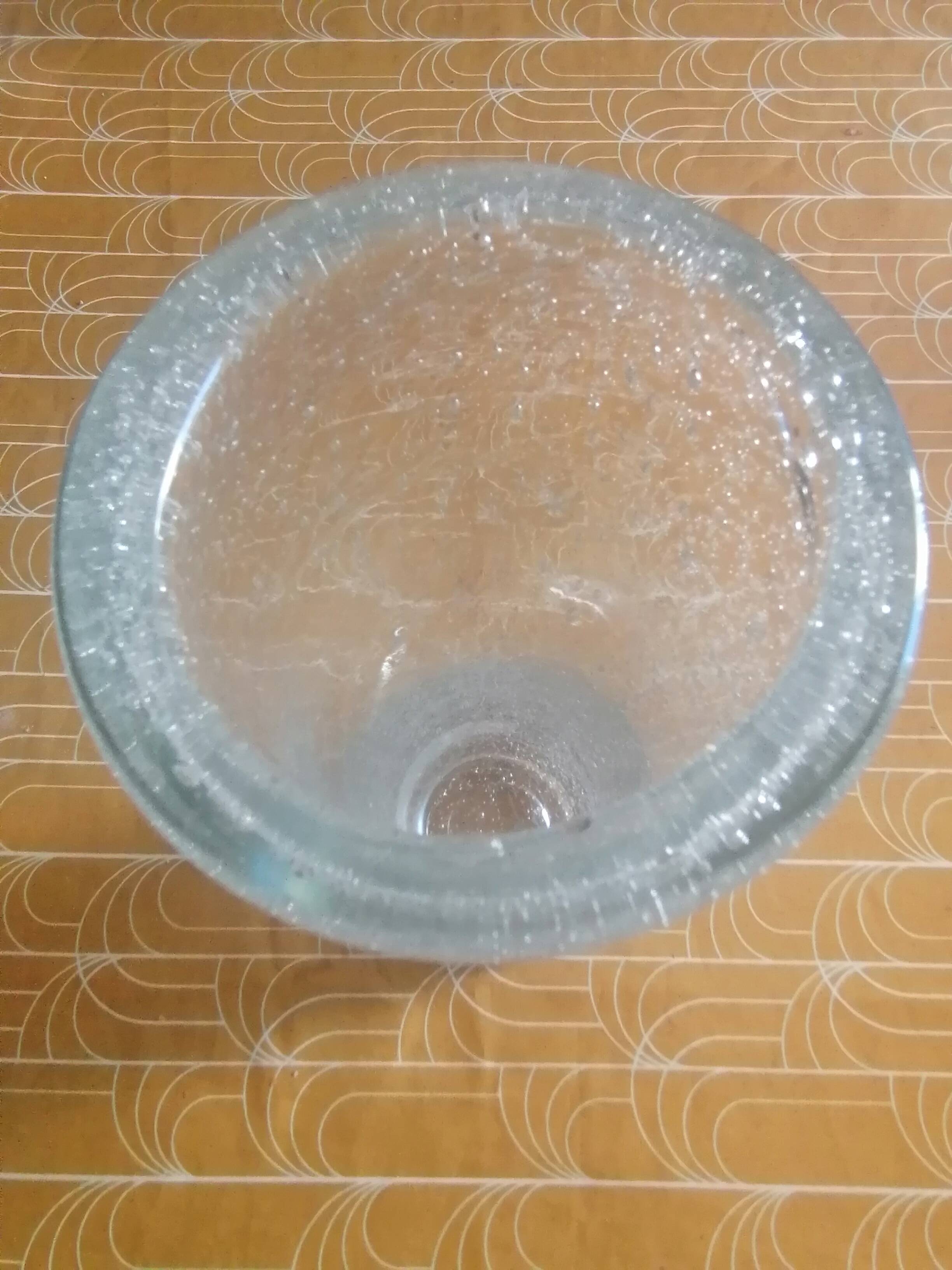 Old biot glass roller vase