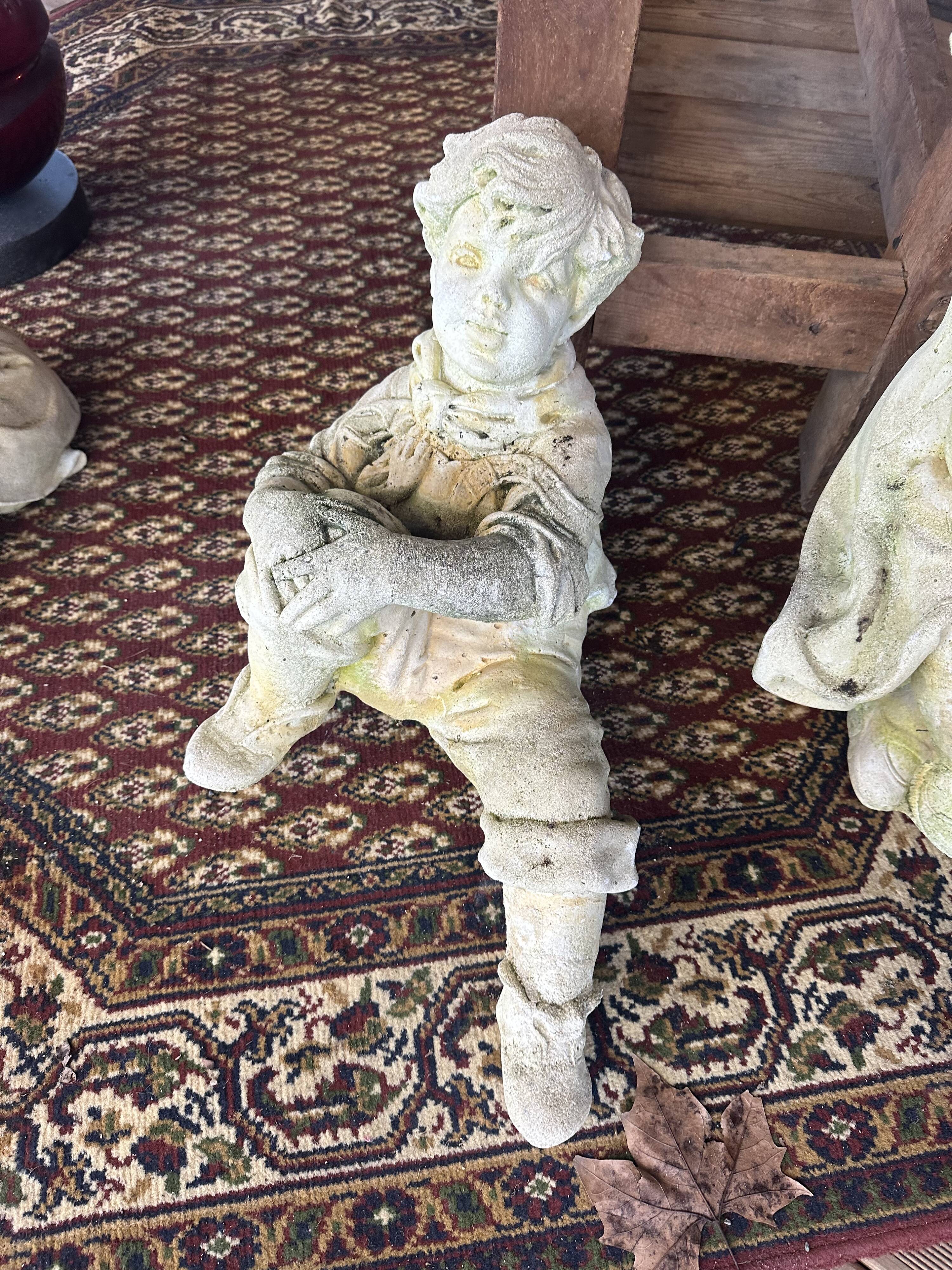 Stone child garden statue