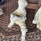 Stone child garden statue