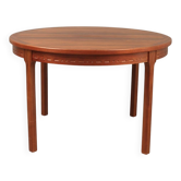 Round dining table in rosewood.