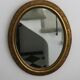 Oval gold mirror in Napoléon III style