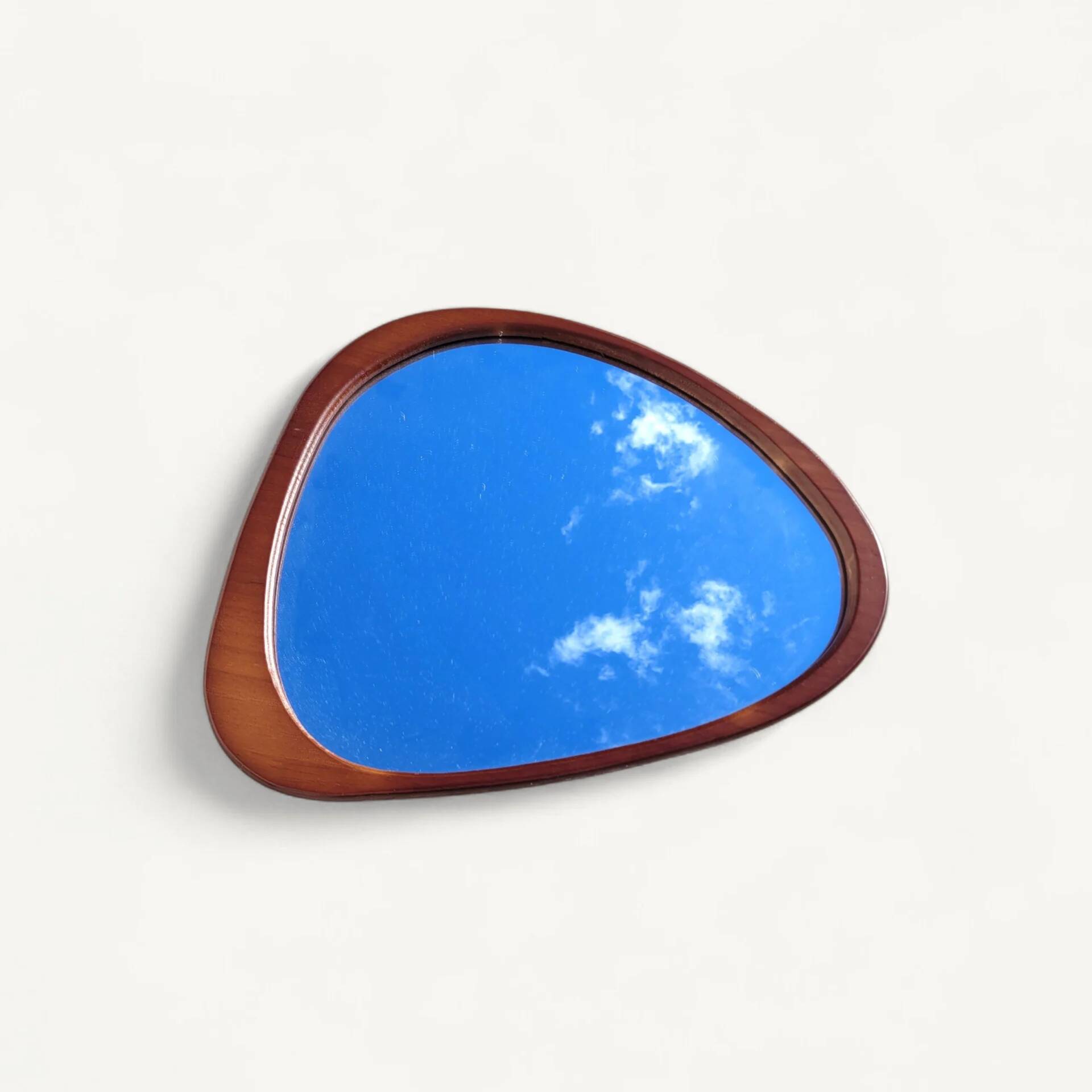 Contemporary oval mirror in teak finish