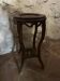 Carved wooden pedestal with pink marble top