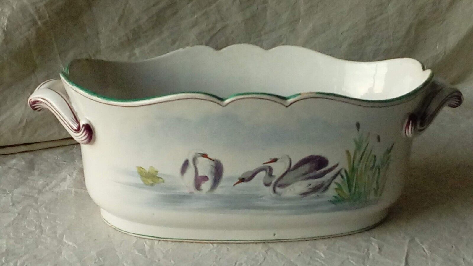 St Clement faience jardiniere with marine and swan decoration, early 20th century.