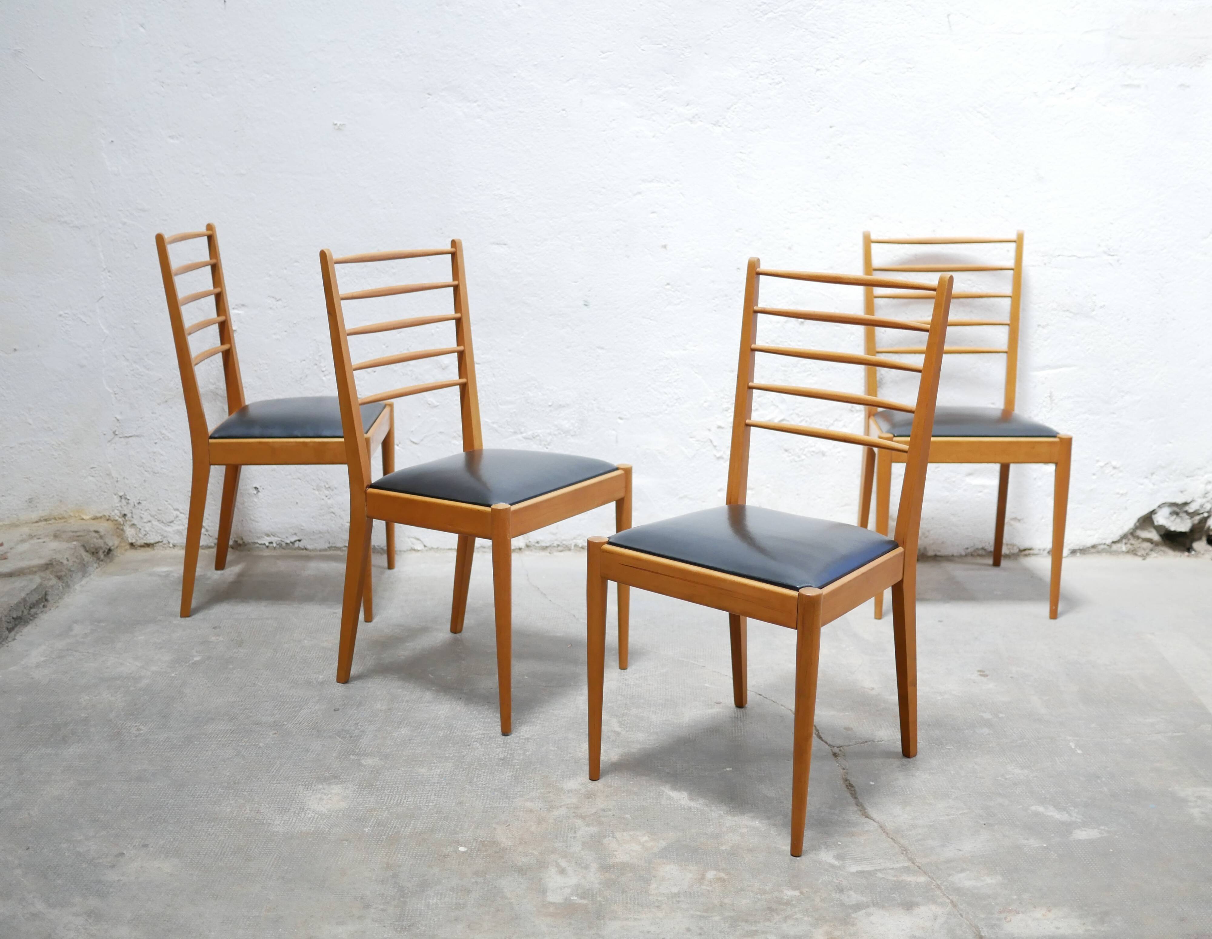 Series of 4 vintage chairs in wood and skaï