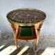 Hot water bottle table with a marble top and a brass gallery.