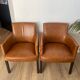 Chair with armrests in aged brown cowhide leather