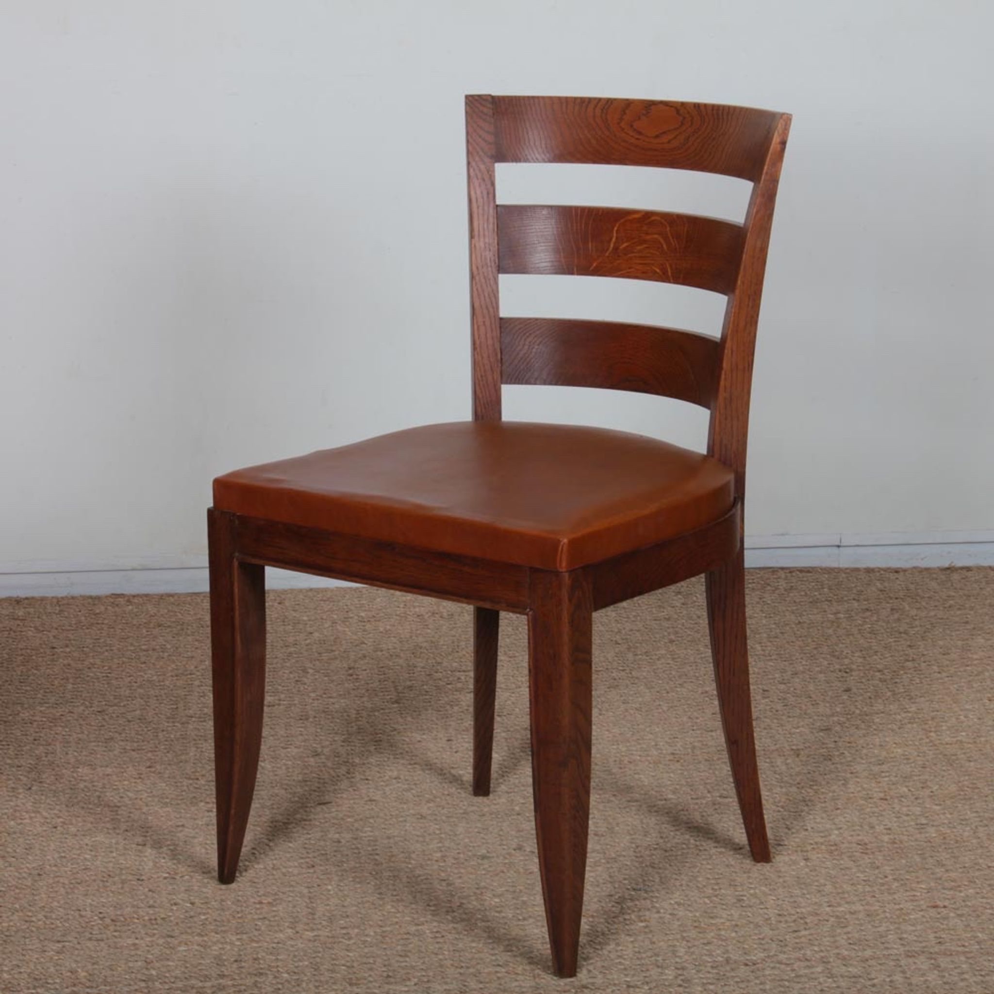 Set of 6 oak chairs in the style of Jean Pascaud, 1940.