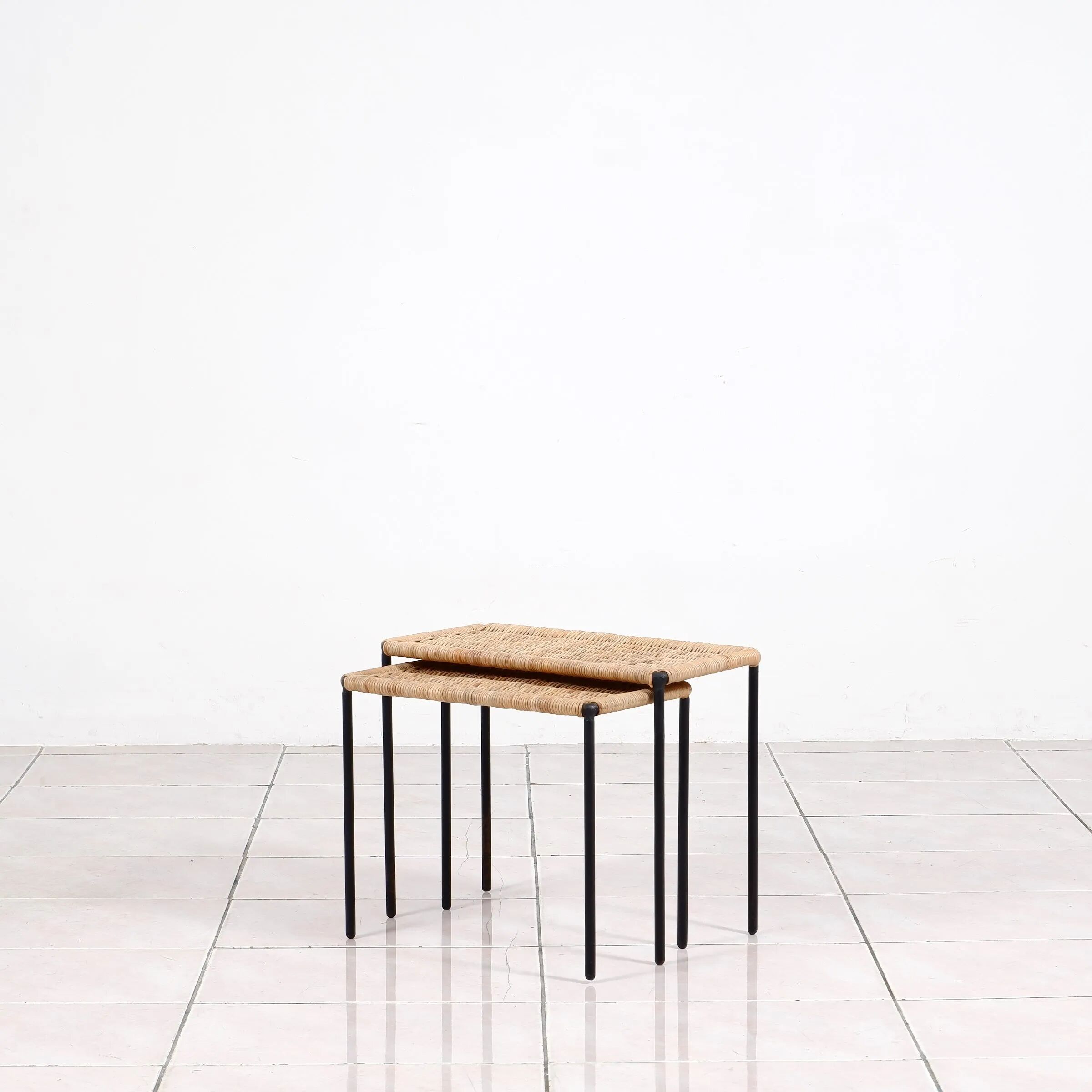 Nesting tables in metal / rattan by Carl Auböck