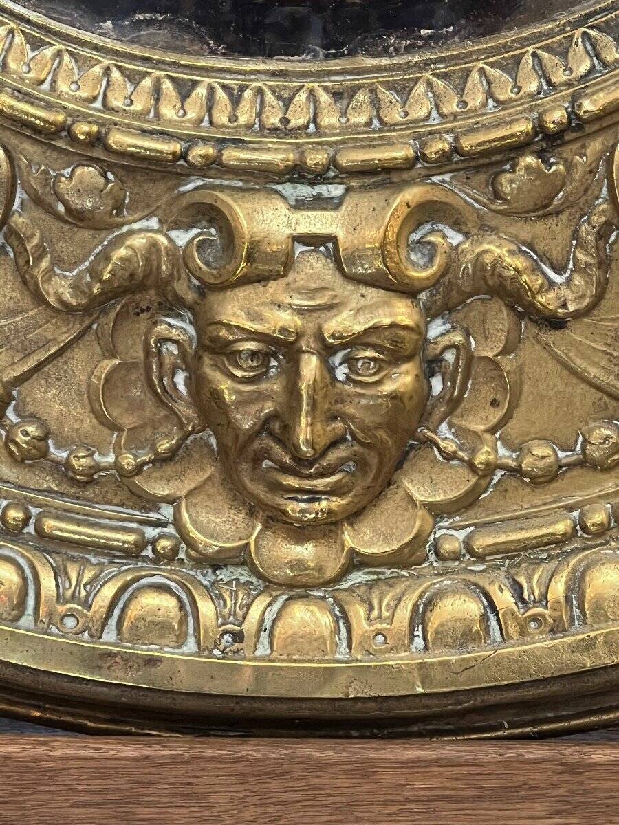A. Arens, Antwerp, important oval mirror in repoussé brass with numerous animal decorations