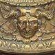A. Arens, Antwerp, important oval mirror in repoussé brass with numerous animal decorations
