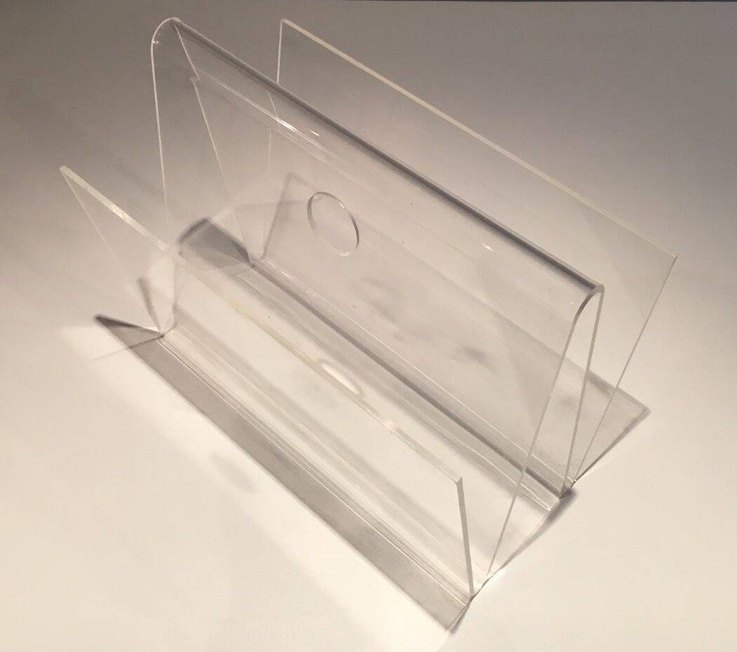Acrylic magazine rack. Circa 1970.