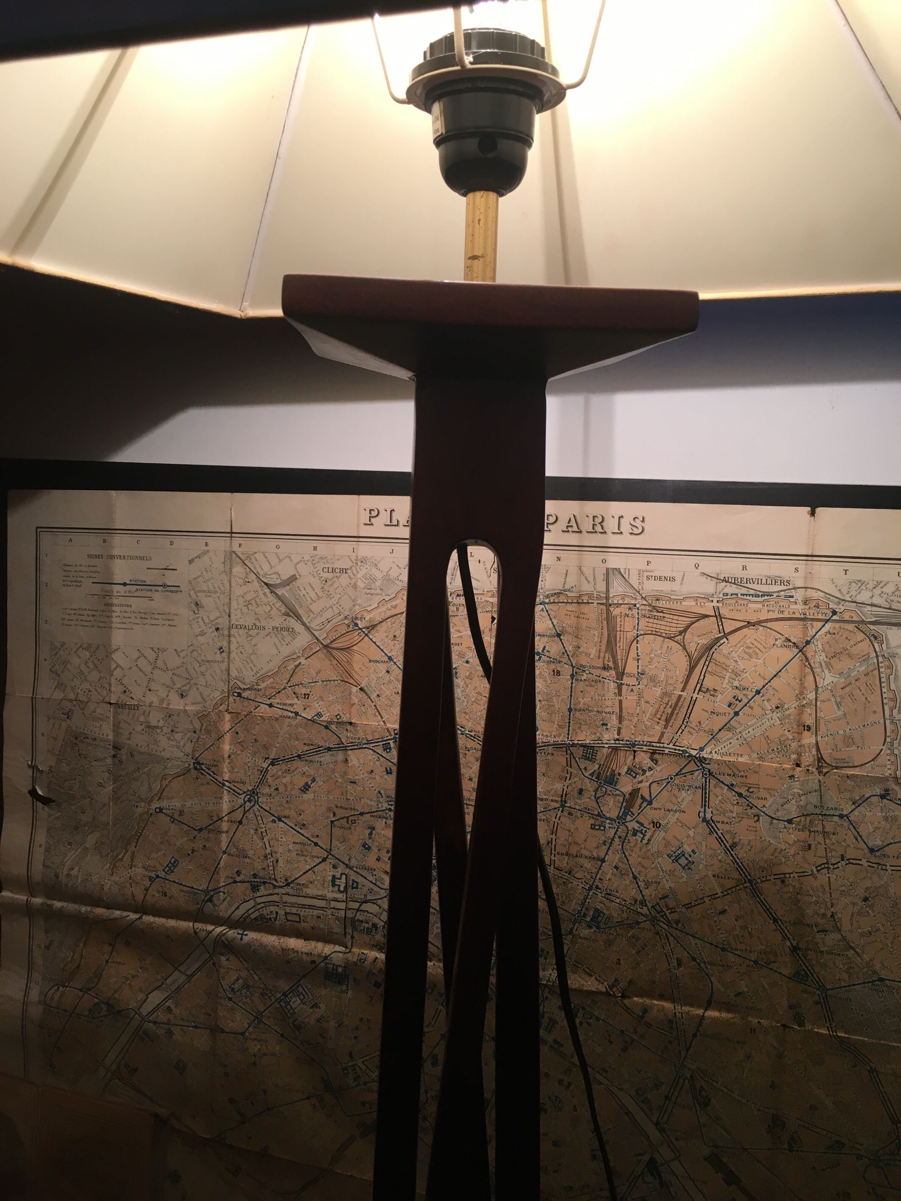 Mahogany lamp with a sculpted base.