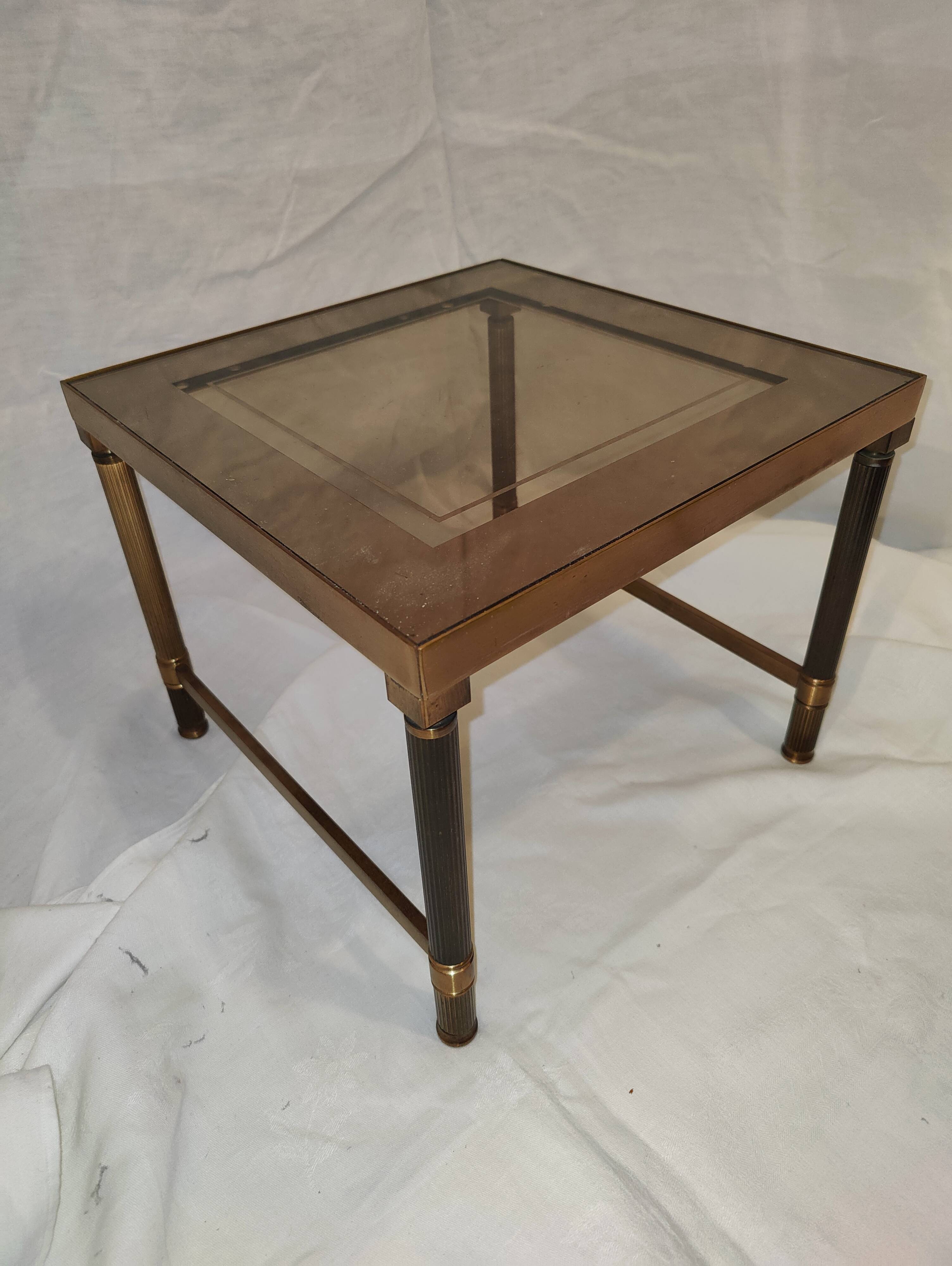 Small table or side table with brass structure and glass top from the 1970s.