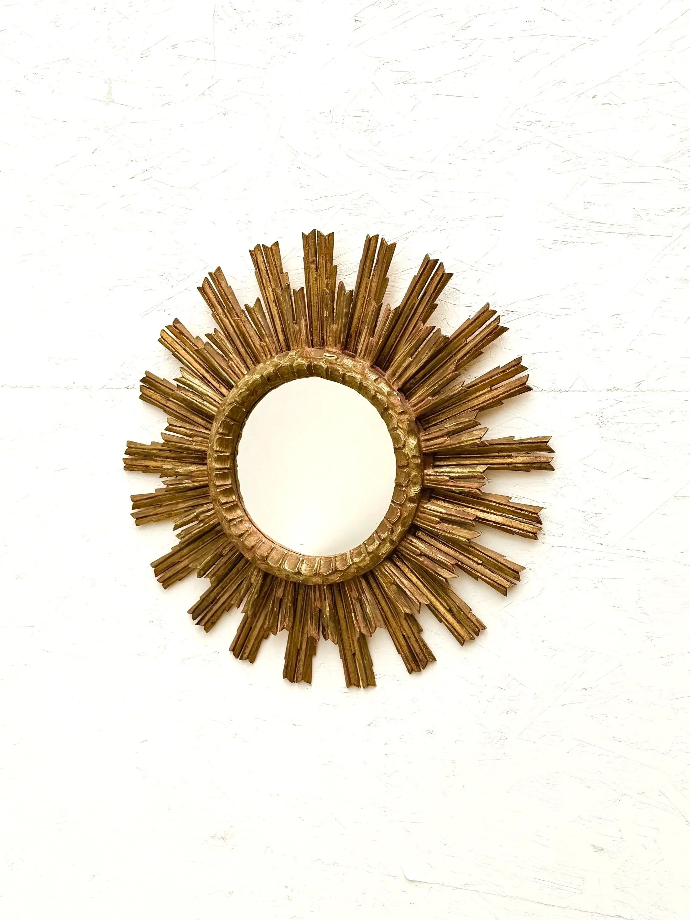 Large sun mirror in gilded wood, 1960