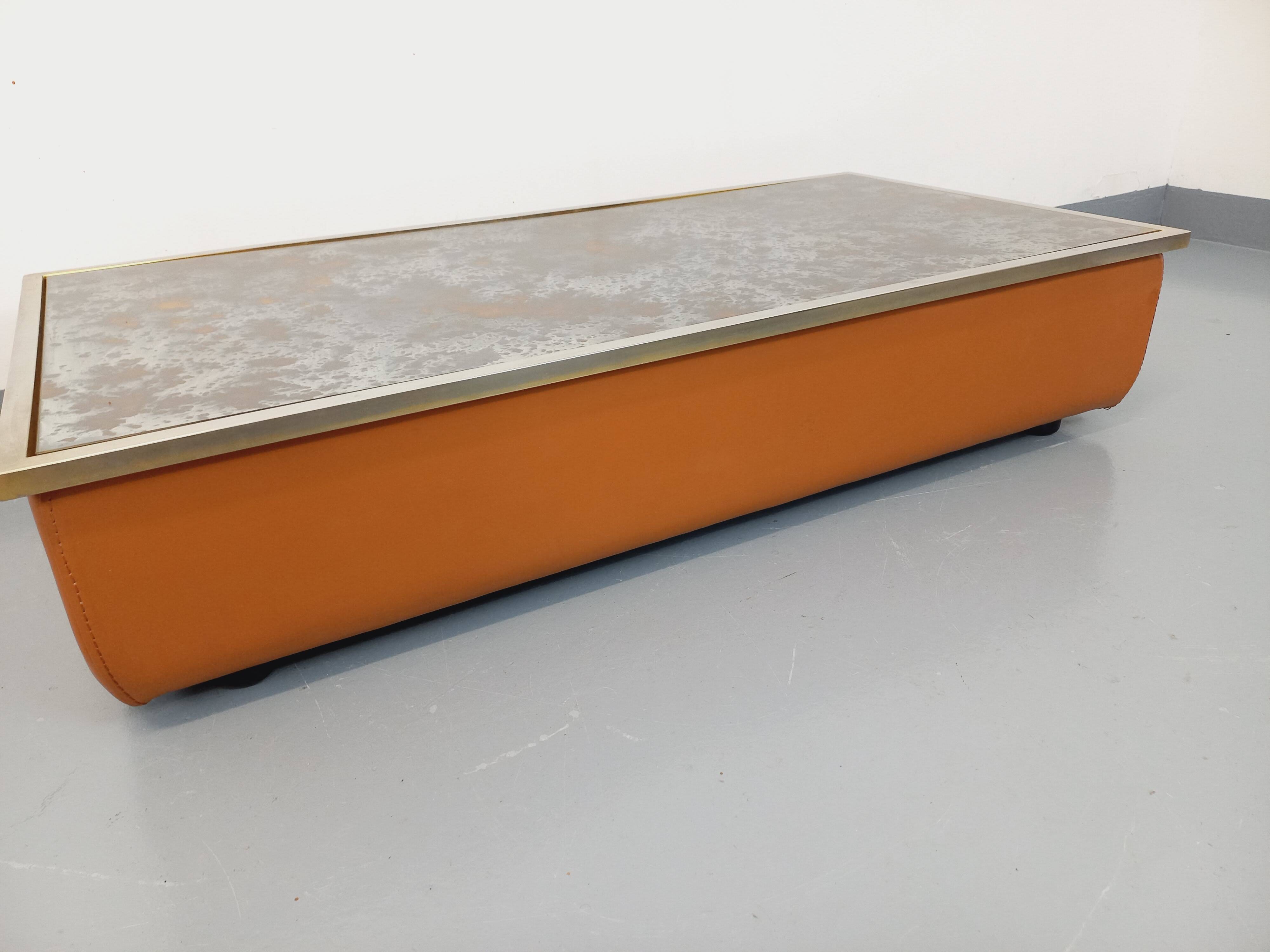 Vintage coffee table in églomisé glass, chrome and leather from the 70s