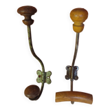 2 mismatched steel and wood coat hooks
