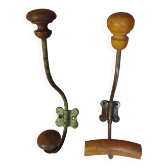 2 mismatched steel and wood coat hooks