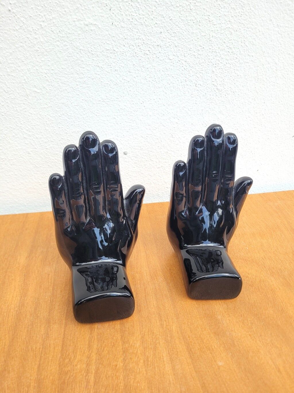 Pair of vintage black ceramic hand bookends
