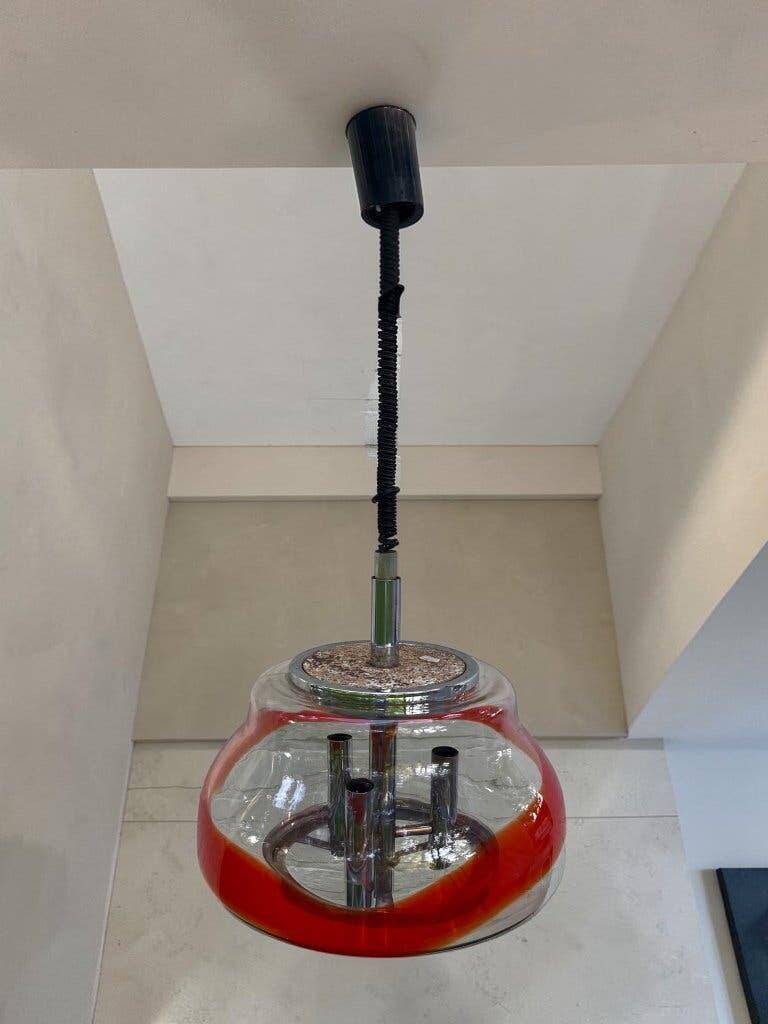 Vintage Murano glass pendant light with orange accent.