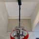 Vintage Murano glass pendant light with orange accent.