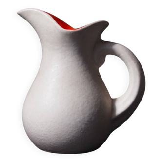 White and orange pitcher with organic curves