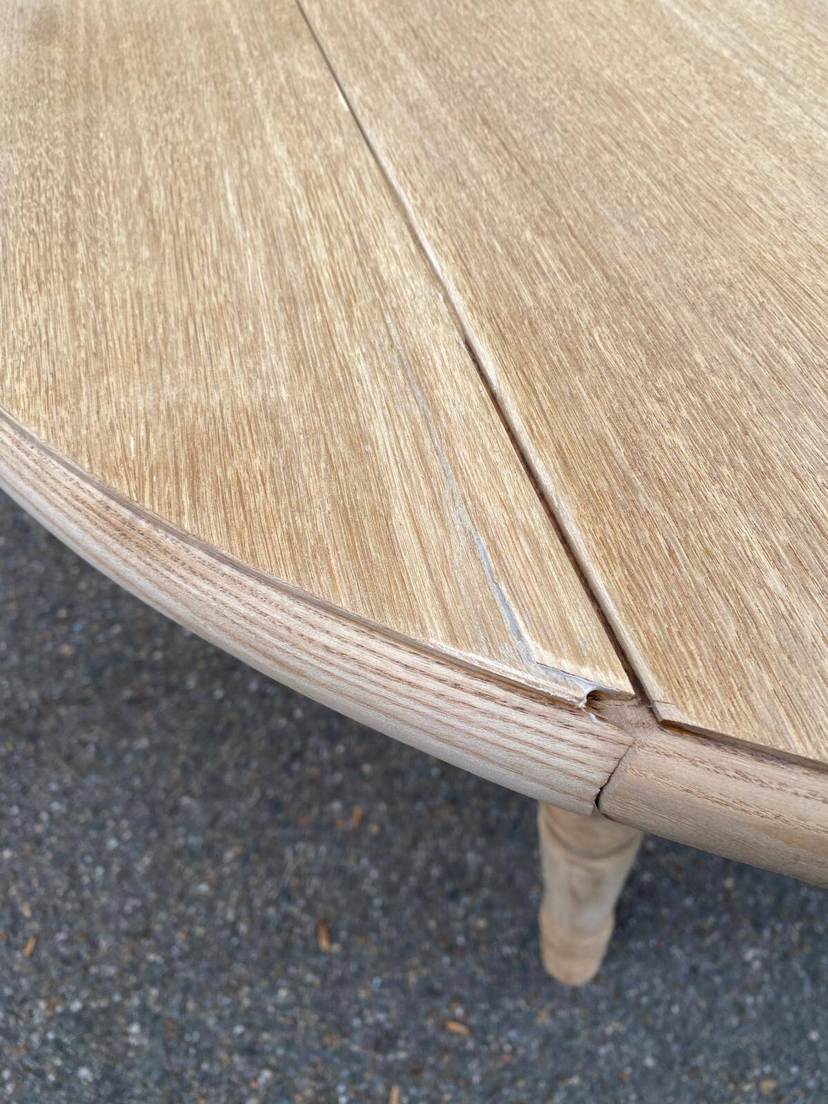Round dining table with extendable leaves, Louis Philippe style, stripped in raw oak.
