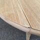 Round dining table with extendable leaves, Louis Philippe style, stripped in raw oak.