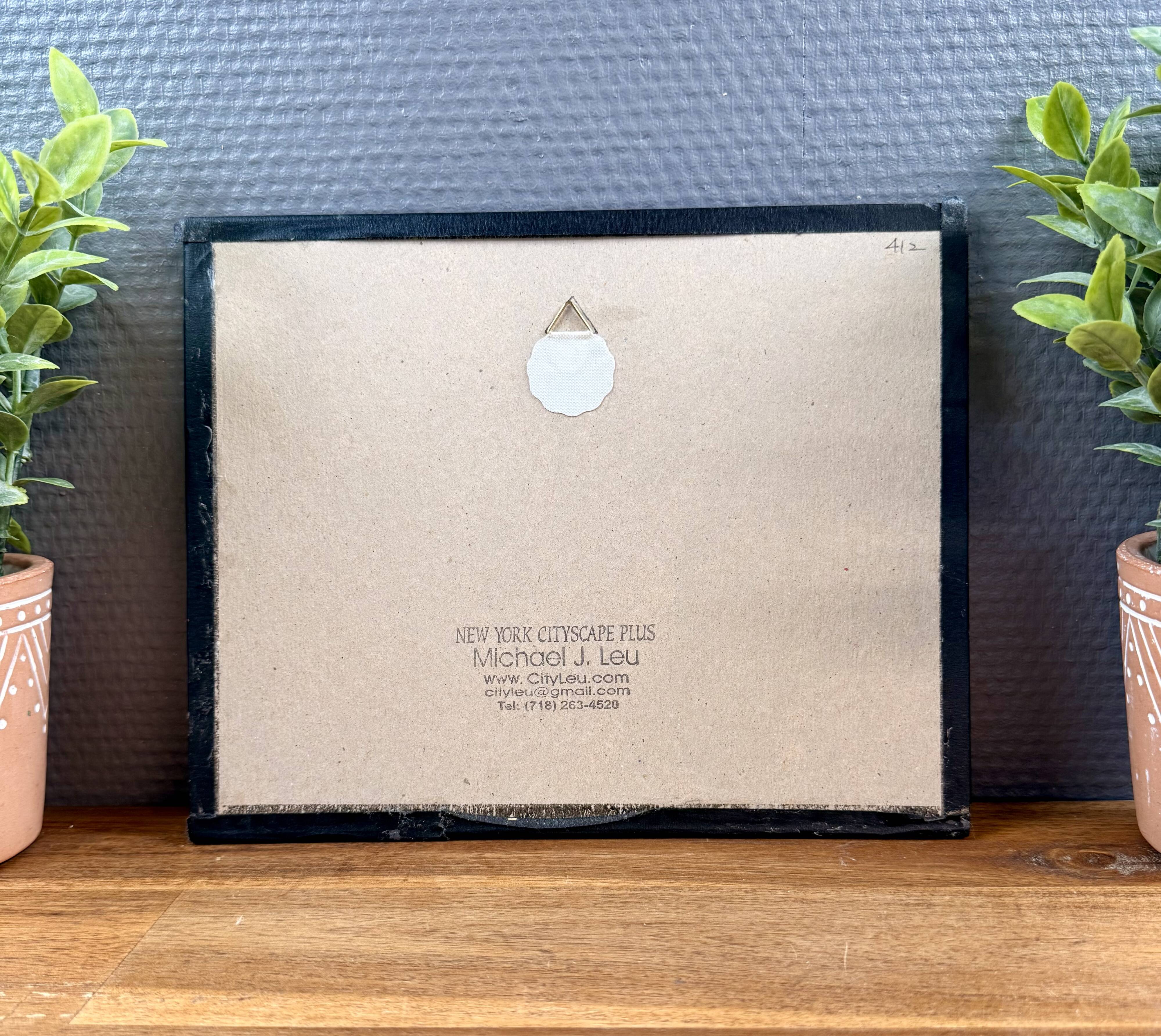 Print by Michael J. Leu – winter urban scene – framed