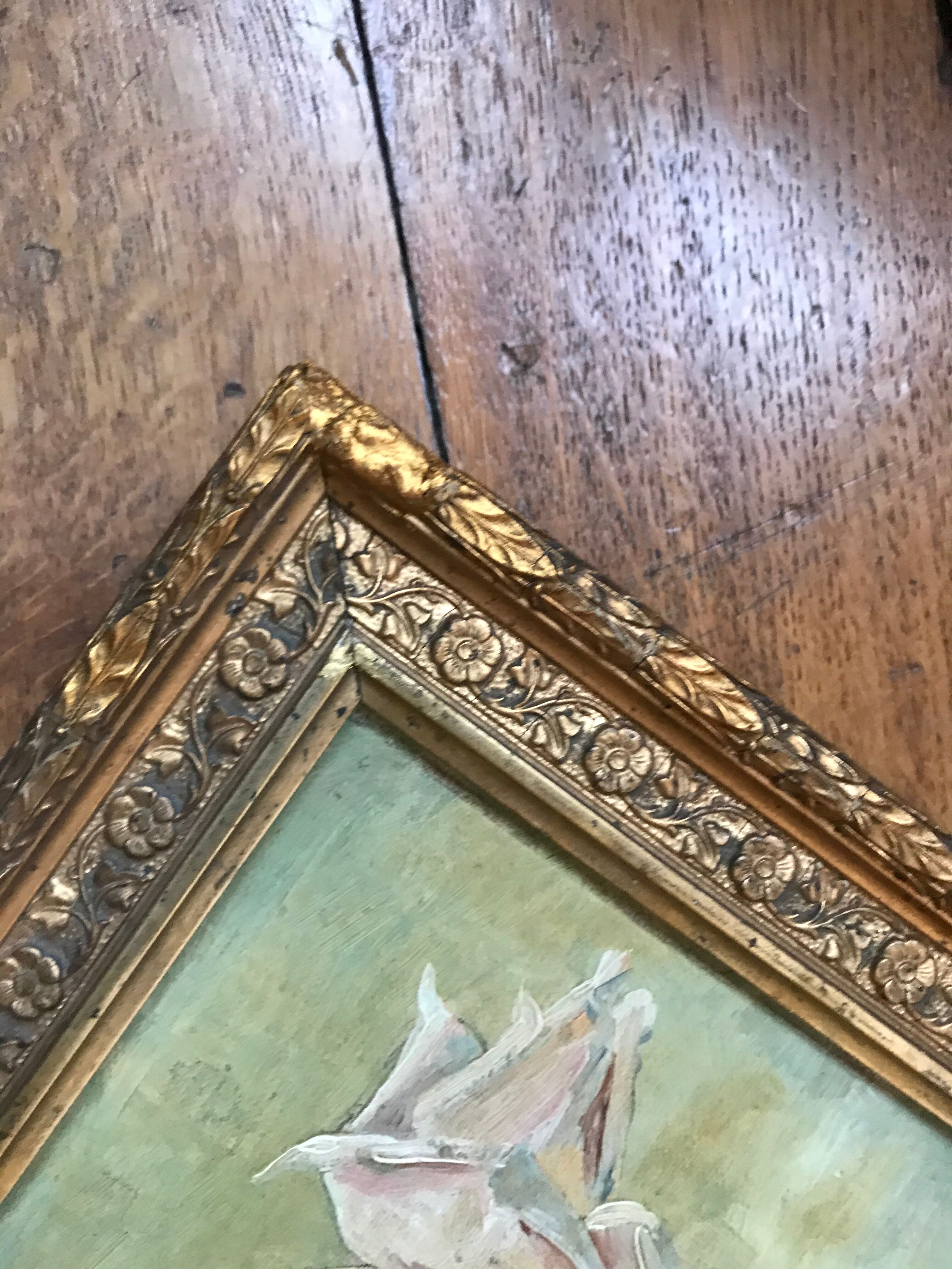 Two old paintings of flowers and gilded frames