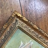 Two old paintings of flowers and gilded frames