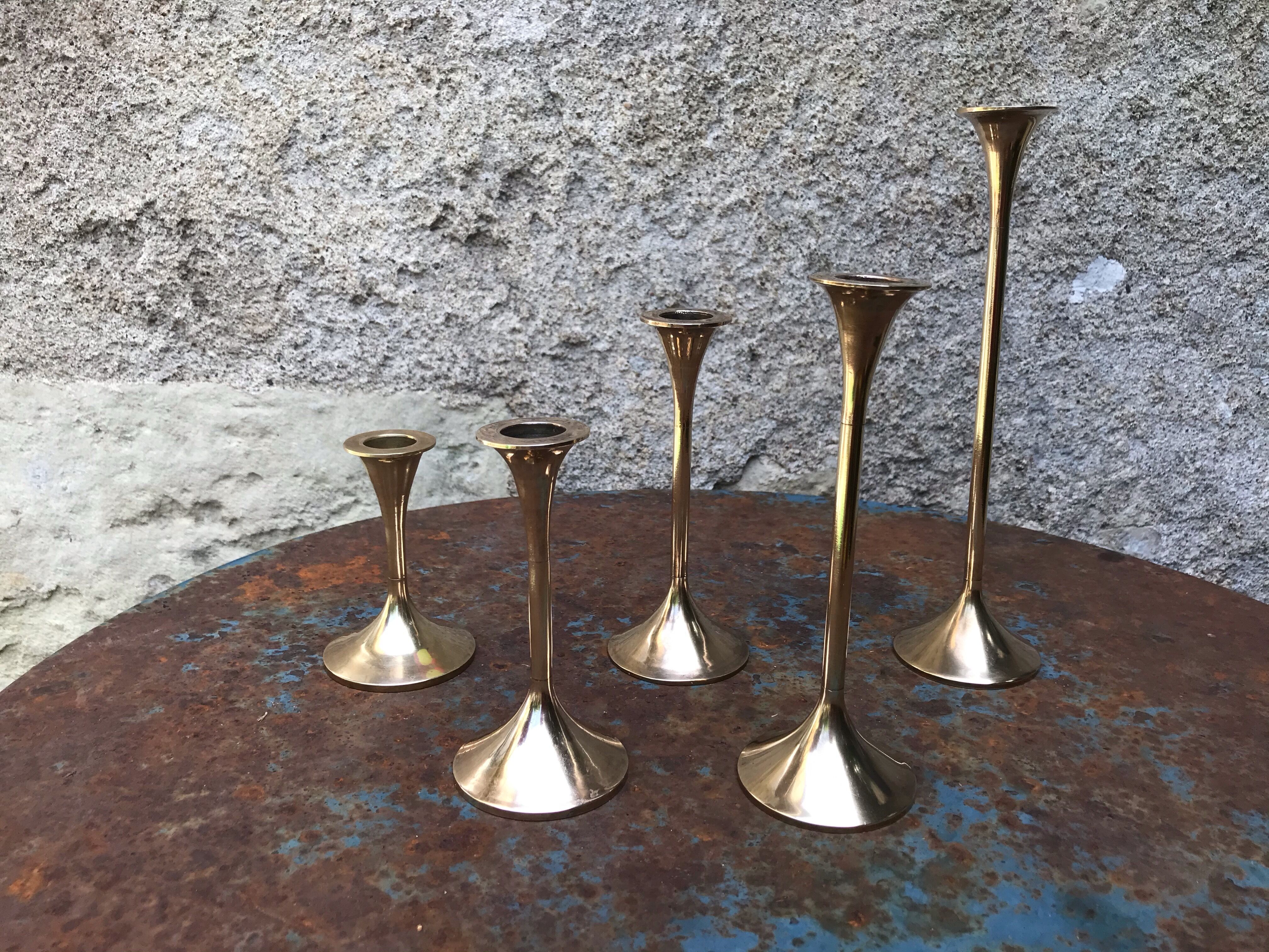 Series of 5 brass candlesticks